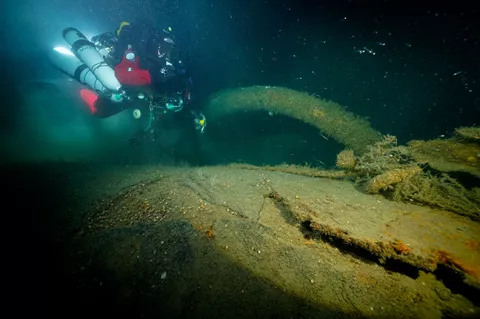 Diver with one of the davits on RMS Lusitania. Photo by Vic Verlinden.